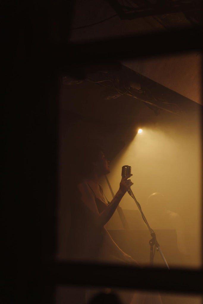 Dimly lit muscian on stage